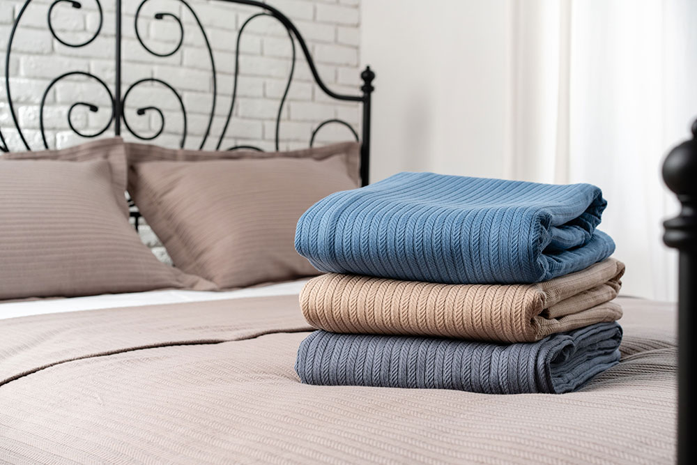 blue-beige-blankets-made-bed